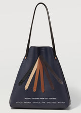 A straight on view of the buttery soft Australian Made Navy Nappa Bespoke Tote, showcasing all handle options from Charlie Middleton.