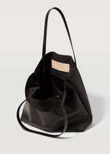 A close view of the buttery soft Australian Made Black Nappa Bespoke Tote. Showing the inside pocket of the tote bag and Charlie Middleton logo.