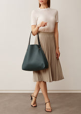 A model showcasing the buttery soft Australian Made Bottle Nappa Bespoke Tote from Charlie Middleton.