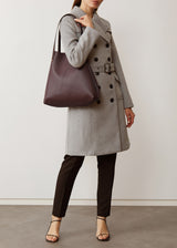 A studio style photo of the Burgundy Vogue Bespoke Tote from Charlie Middleton.