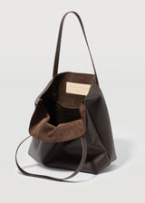 A close view of the buttery soft Australian Made Chocolate Nappa Bespoke Tote. Showing the inside pocket of the tote bag and Charlie Middleton logo.