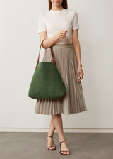 A model showcasing the Italian cow-suede Australian Made Forest suede Bespoke Tote from Charlie Middleton.