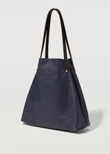 A side on view of the buttery soft Australian Made Navy Nappa Bespoke Tote by Charlie Middleton.