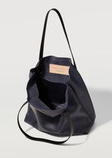 A close view of the buttery soft Australian Made Navy Nappa Bespoke Tote. Showing the inside pocket of the tote bag and Charlie Middleton logo.