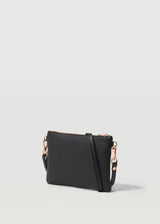 A side on view of the Black Nappa Essentials Crossbody bag by Charlie Middleton.